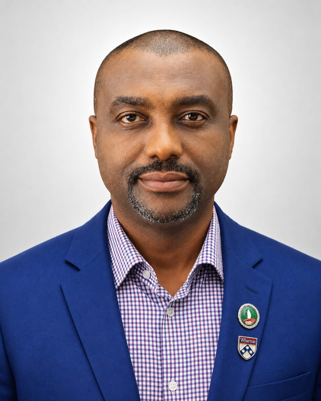 Portrait of Alberto Osuji, Enterprise Agile Transformation Coach, in a navy suit and red tie
